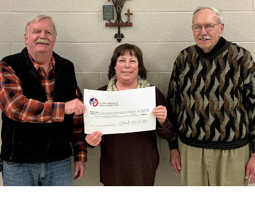Clintonville Goodfellows Association President Steve Conradt (left) accepts a $3,000 grant from Clintonville Area Foundation Board members Sue Aschliman and DuWayne Federwitz (L to R).