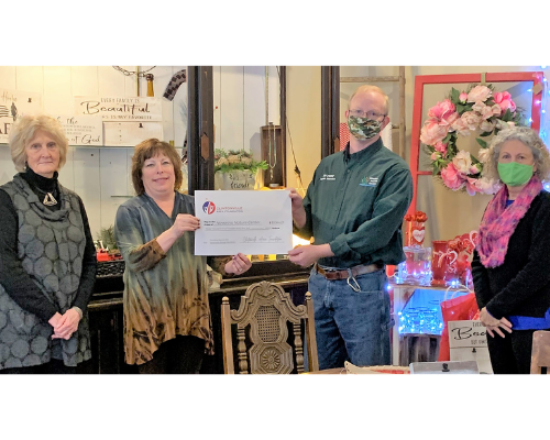 Navarino Nature Center Director/Naturalist Tim Ewing (third, L to R) accepts a $3,564.23 grant from past Clintonville Area Board member Kathy Akey, and current Board members Sue Aschliman and Joy Krubsack (L to R).